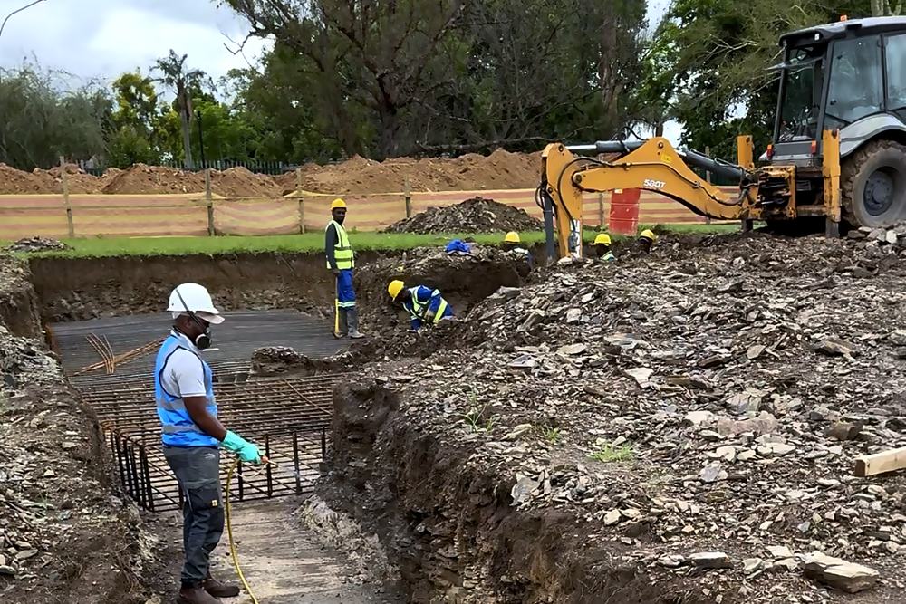 Termiticide being applied to an open foundation trench in the Upper Highway area